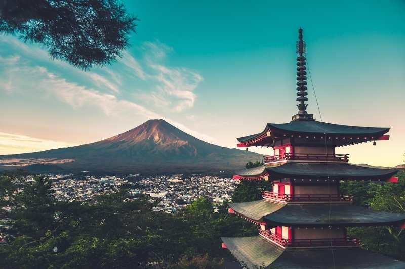 japanese building with mountain in background