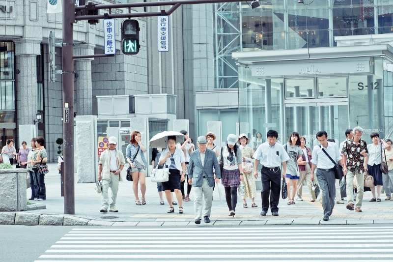 Japanese people walking on street